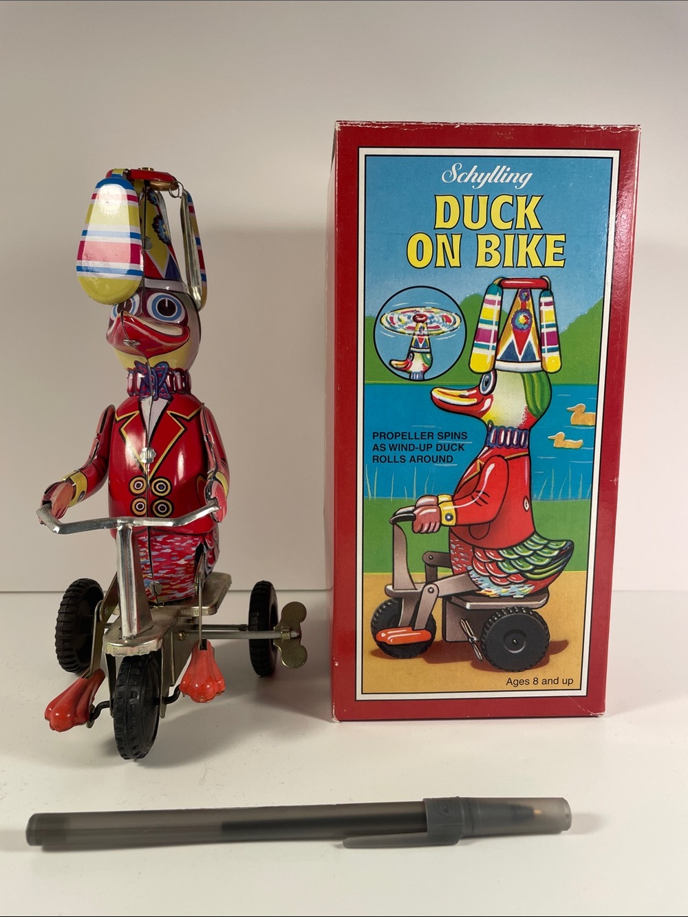 Schylling Duck on Bike Wind-Up Tin Toy - Red with Multicolor Helmet